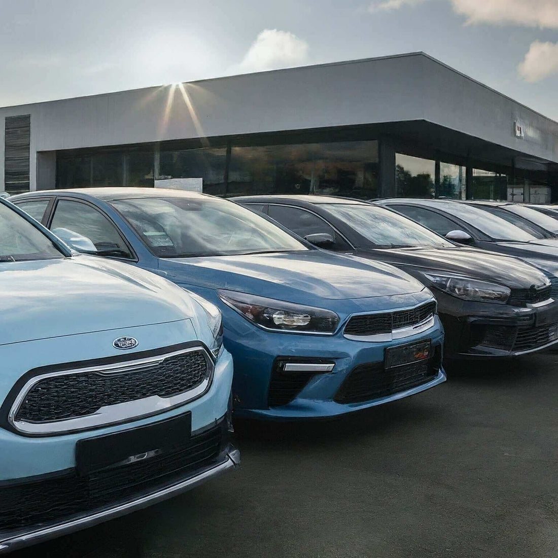 Lineup of cars at dealership reflecting US auto market trends in a shifting landscape.
